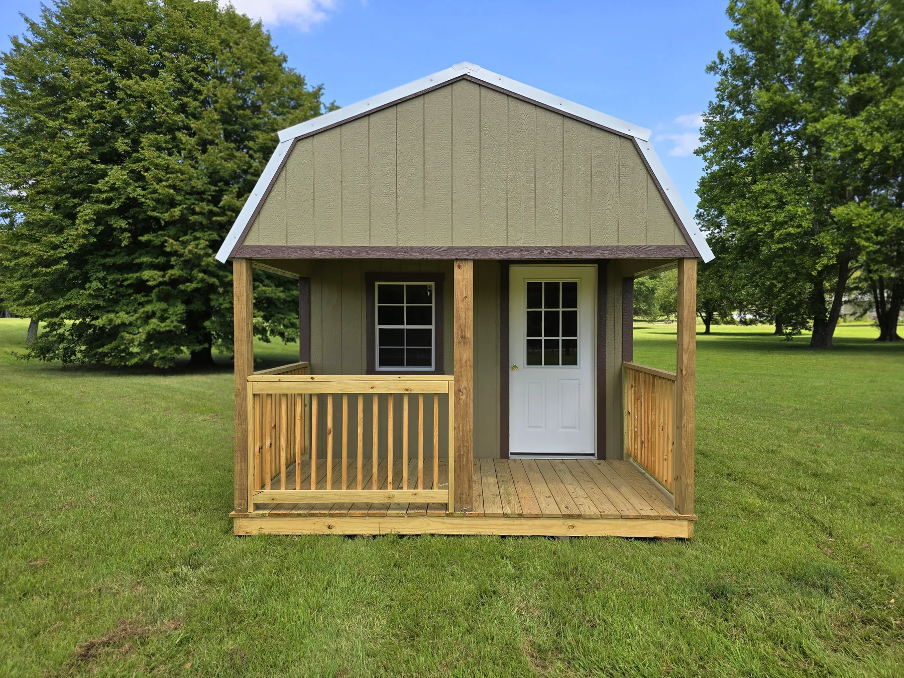 Olive lofted barn cabin shell with a porch and gambrel roof
